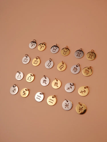GOLD ZODIAC STAINLESS STEEL CHARM - Esah and Co